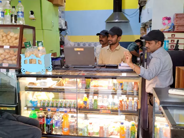 YummyShack team at the counter with privacy-safe capped staff